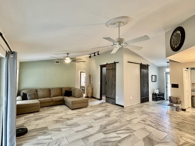 7971 Waupegan Avenue Sebastian, FL 32958 - Photo 7 of 26 a living room with furniture a clock and a ceiling fan