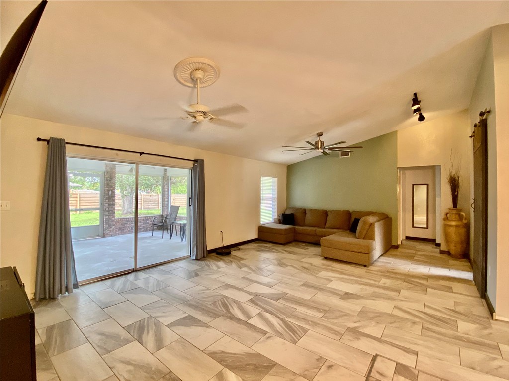 7971 Waupegan Avenue Sebastian, FL 32958 - Photo 10 of 26 a bedroom with a bed and ceiling fan