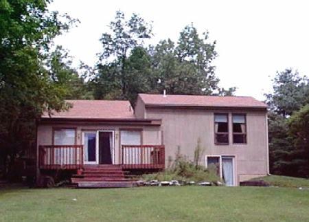 7 Smith Road West Stockbridge, MA 01266 - Photo 1 of 2 a front view of a house with garden