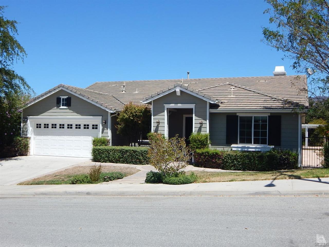 1402 Hidden Ranch Drive Simi Valley, CA 93063 - Photo 1 of 14 a front view of a house with a garden