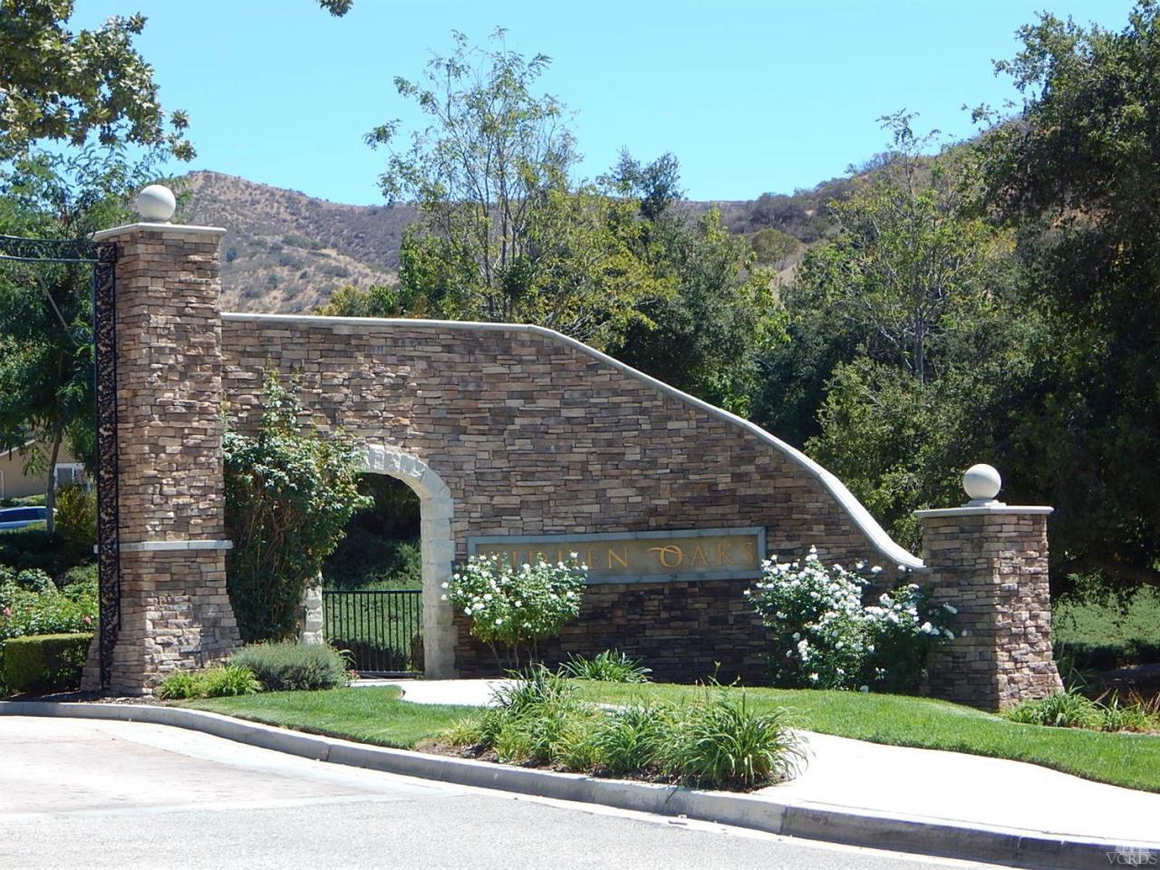 1402 Hidden Ranch Drive Simi Valley, CA 93063 - Photo 14 of 14 a front view of a house with a yard garage and outdoor seating