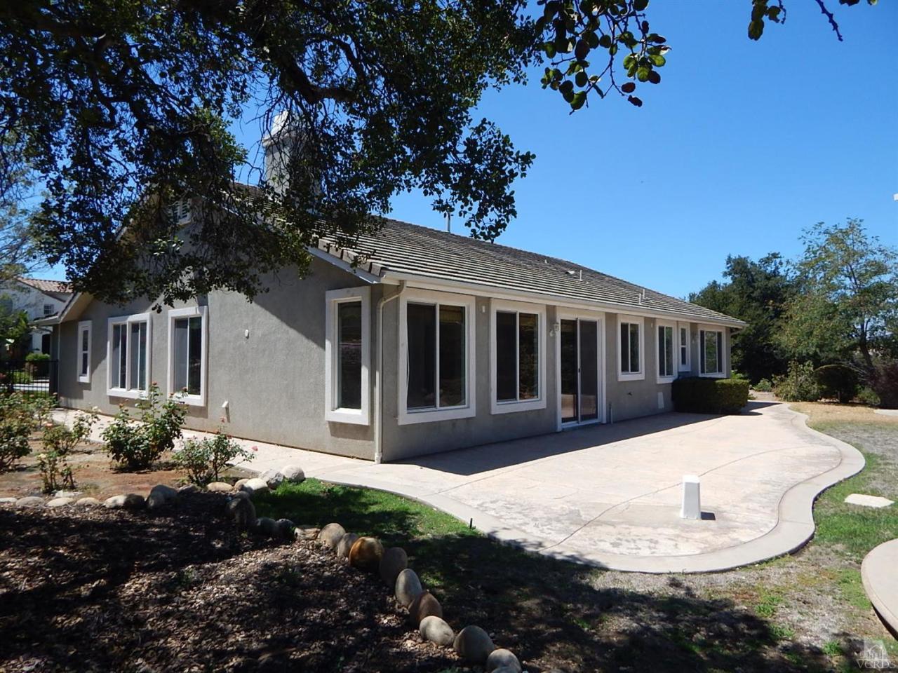 1402 Hidden Ranch Drive Simi Valley, CA 93063 - Photo 4 of 14 a front view of a house with a yard