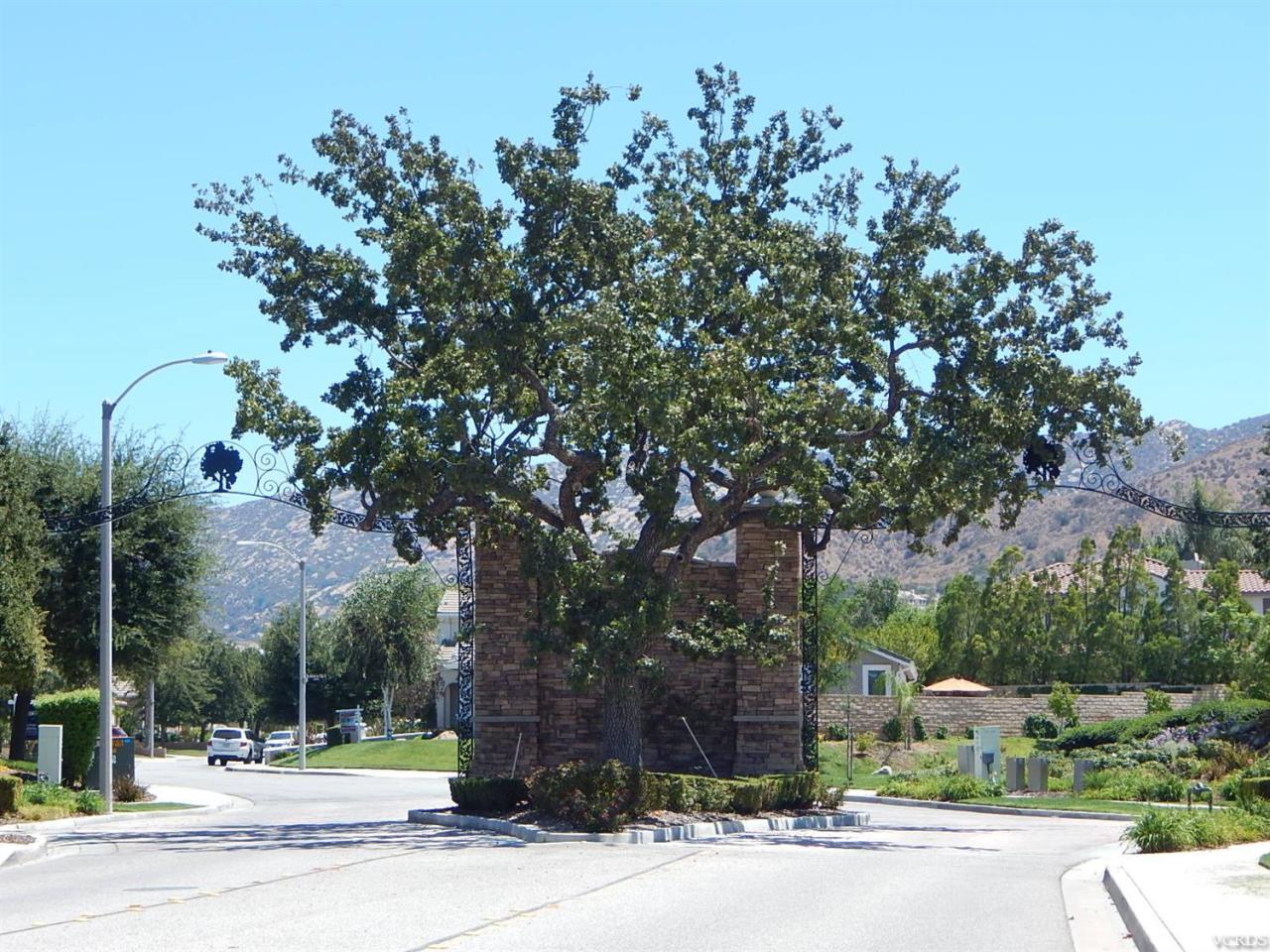 1402 Hidden Ranch Drive Simi Valley, CA 93063 - Photo 5 of 14 front view of a house with a tree and plants