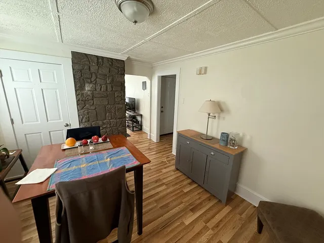 a room with furniture and wooden floor