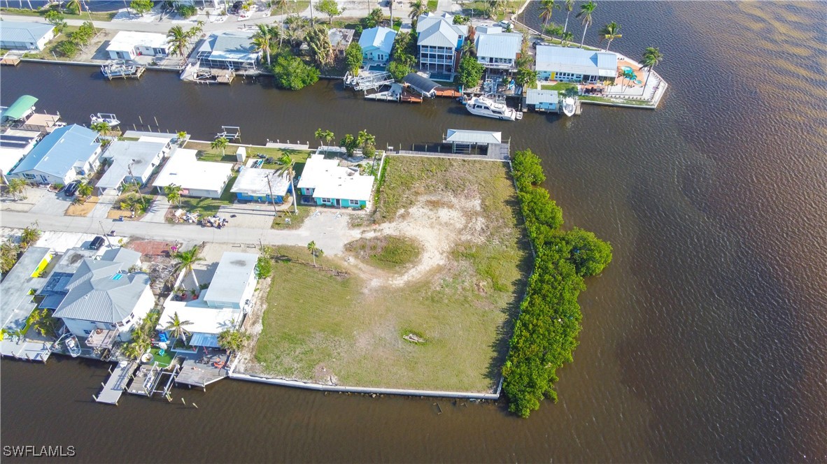 2638 Second Street Matlacha, FL 33993 - Photo 12 of 15 an aerial view of a house with a yard and a fountain