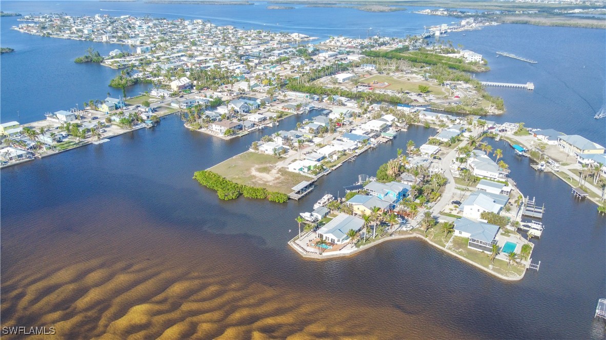 2638 Second Street Matlacha, FL 33993 - Photo 14 of 15 a vase of flowers sitting on a table