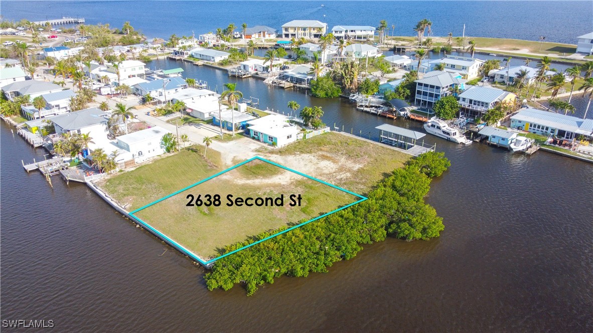 2638 Second Street Matlacha, FL 33993 - Photo 5 of 15 a sign on the side of a road