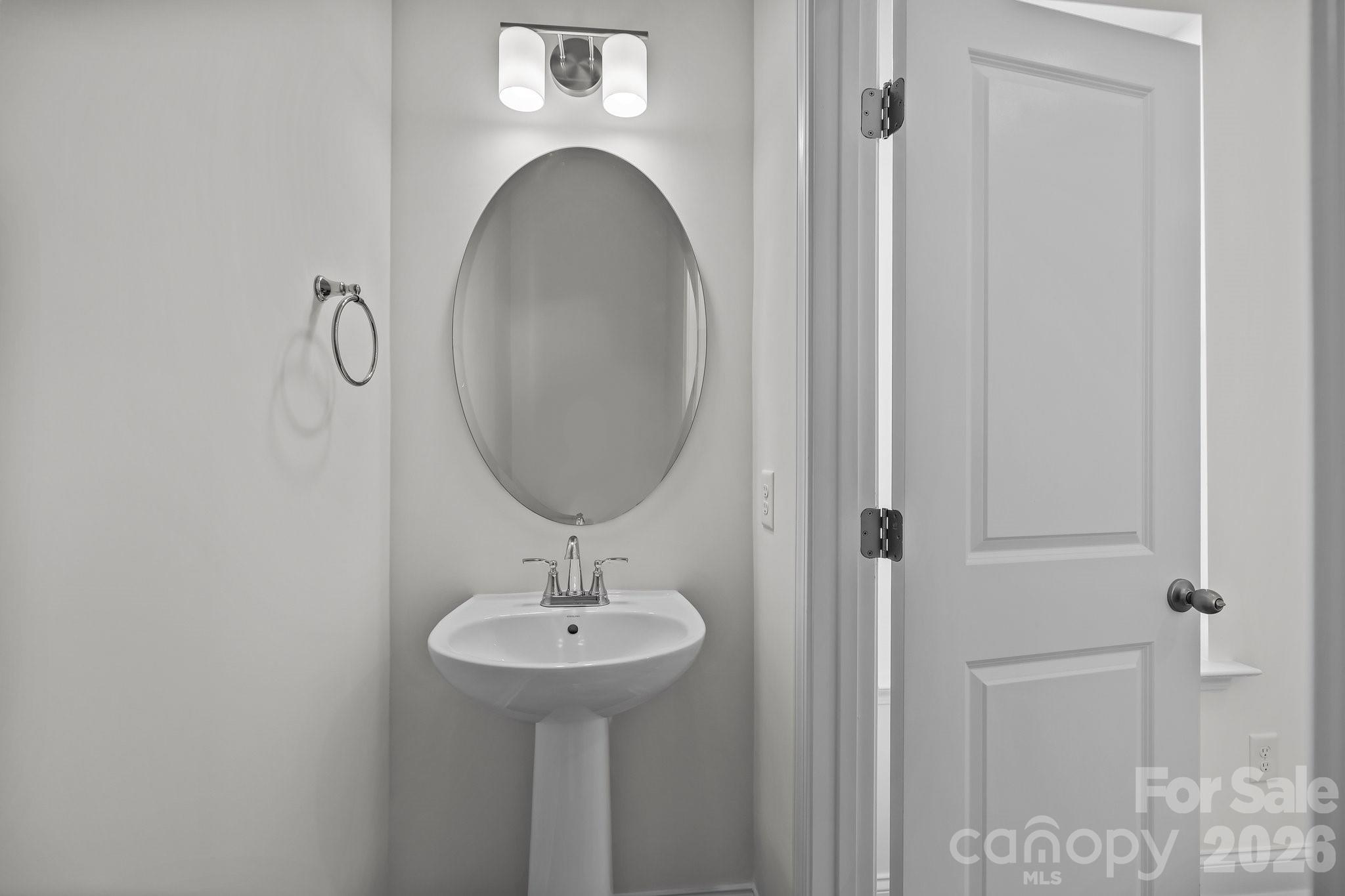 3021 Rozzelles Ferry Road Charlotte, NC 28208 - Photo 12 of 23 a bathroom with a sink and mirror