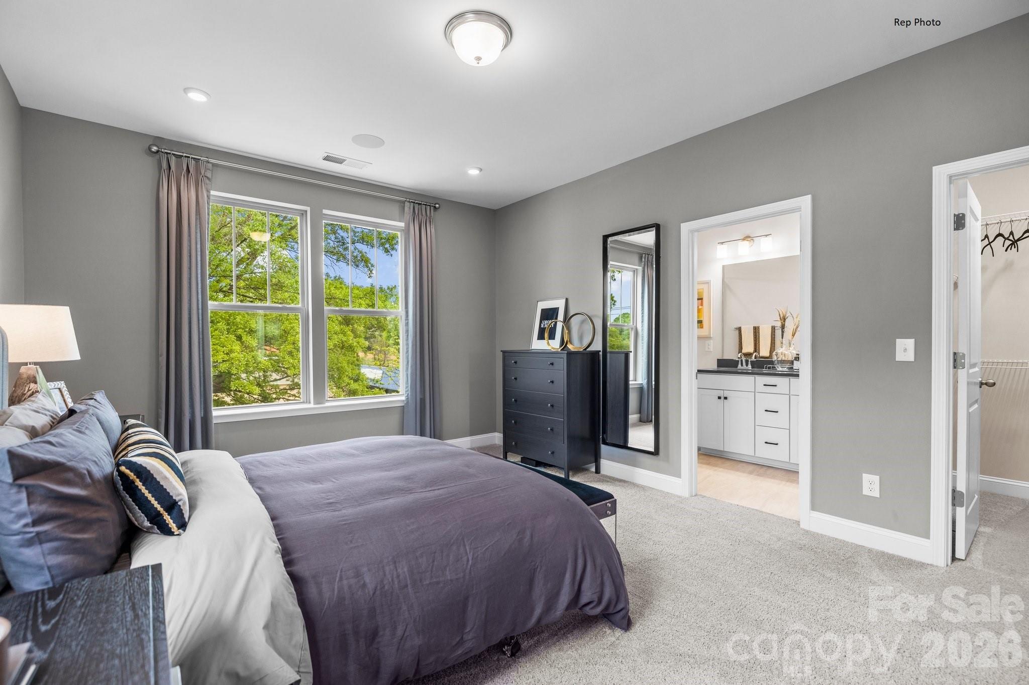 3021 Rozzelles Ferry Road Charlotte, NC 28208 - Photo 13 of 23 a bed room with a bed and a large mirror