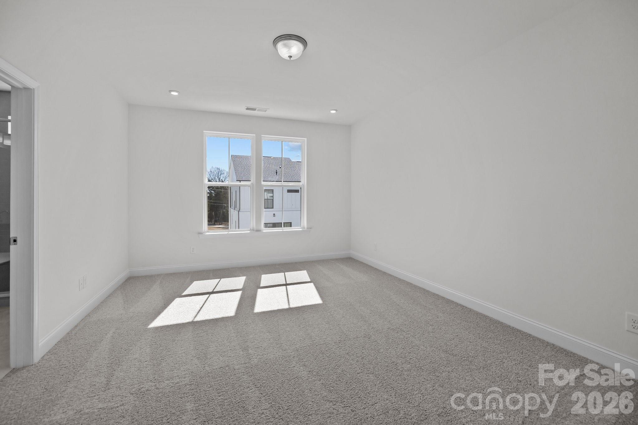 3021 Rozzelles Ferry Road Charlotte, NC 28208 - Photo 15 of 23 an empty room with windows