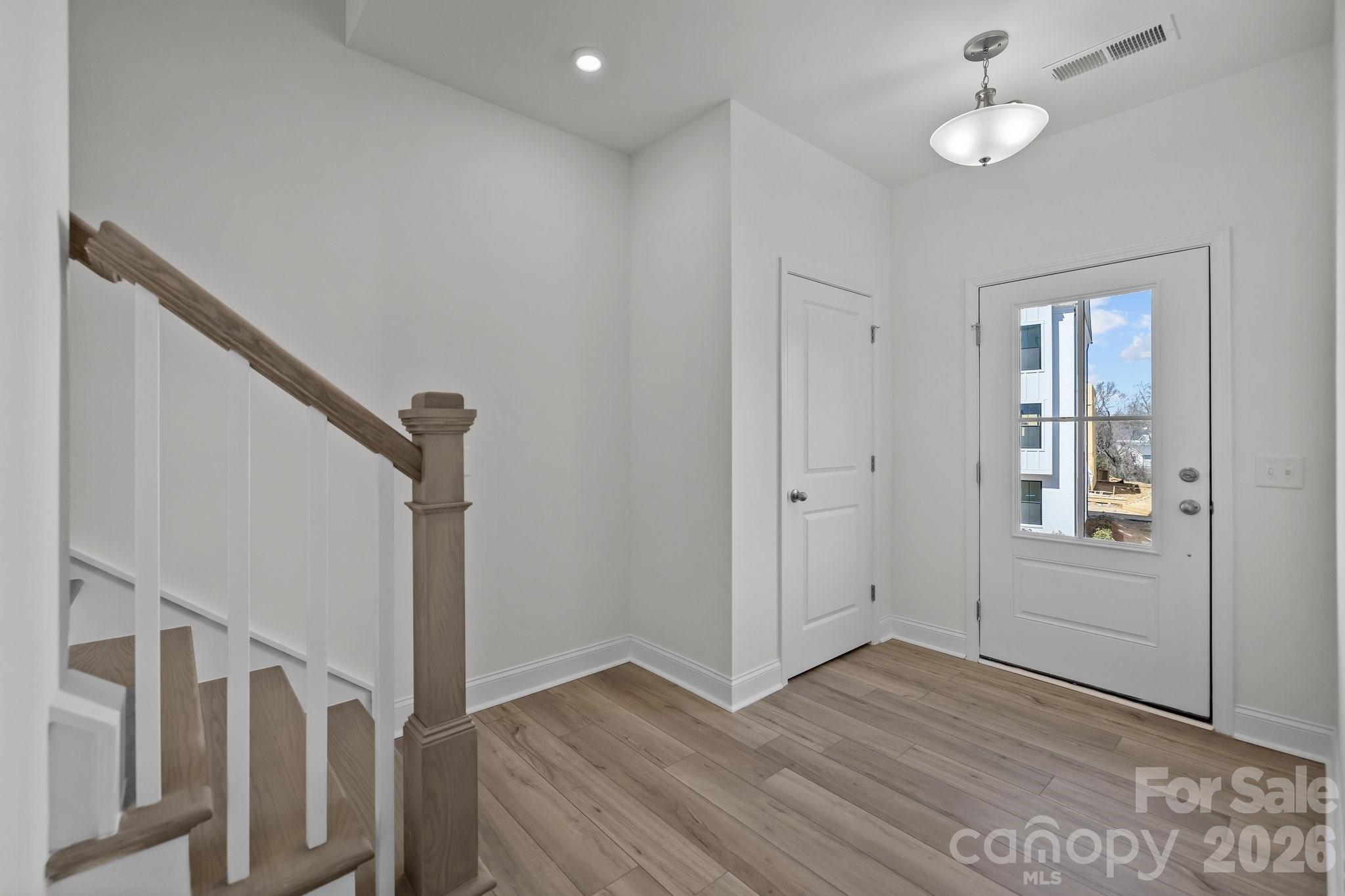 3021 Rozzelles Ferry Road Charlotte, NC 28208 - Photo 2 of 23 wooden floor in an empty room with a window