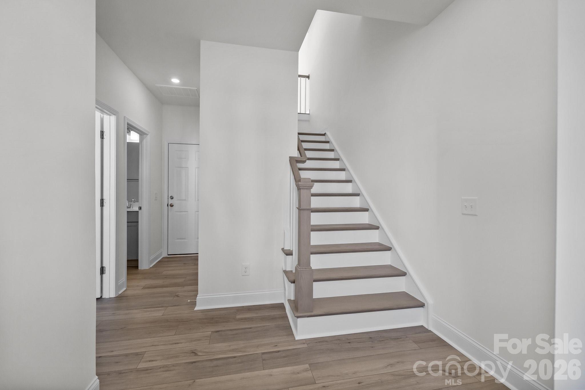 3021 Rozzelles Ferry Road Charlotte, NC 28208 - Photo 3 of 23 a view of a hallway with wooden floor and entryway