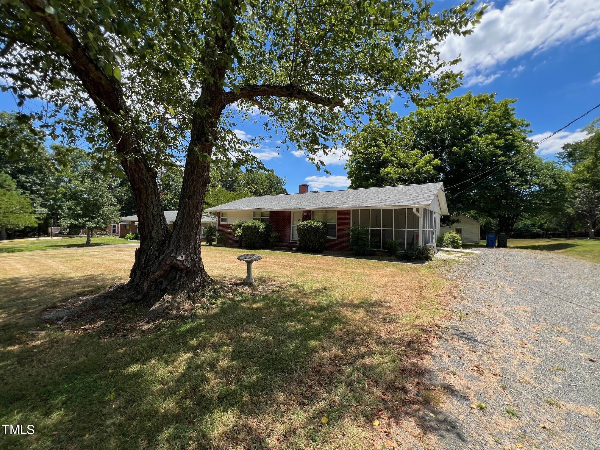 414 Chandler Road Durham, NC 27703 - Photo 3 of 16 a view of a house with a yard