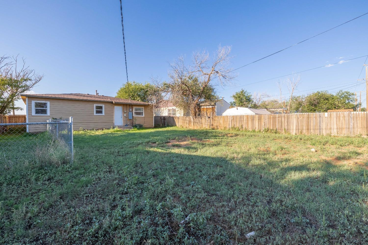 516 7th Street Wolfforth, TX 79382 - Photo 17 of 19 a view of a house with a yard