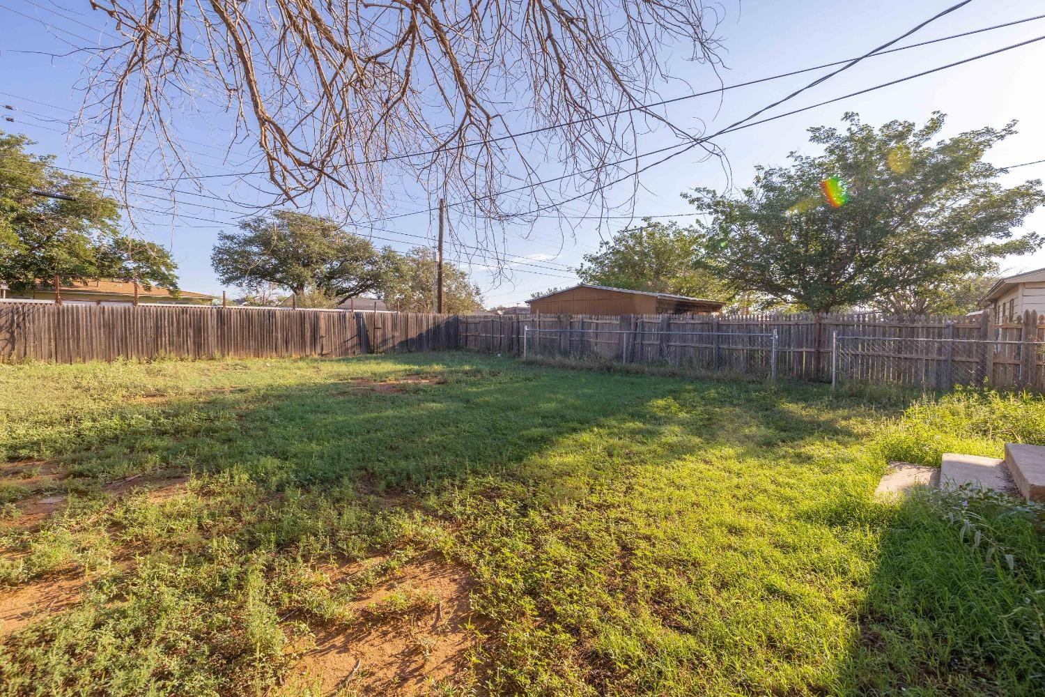 516 7th Street Wolfforth, TX 79382 - Photo 18 of 19 a backyard of a house with lots of green space