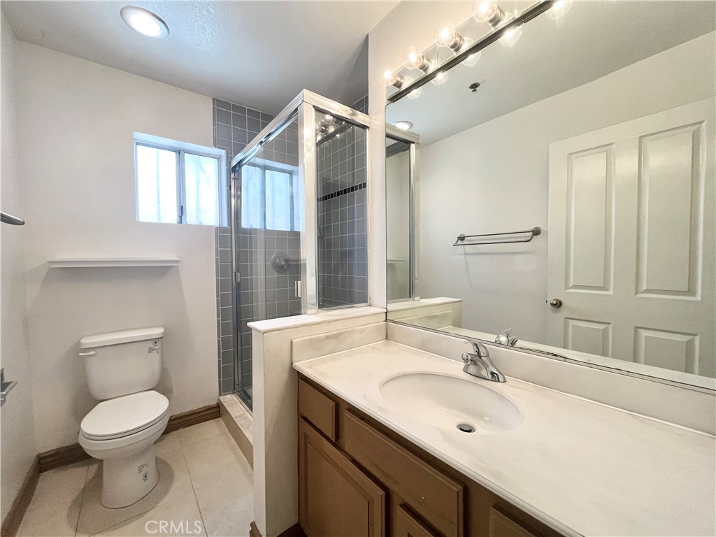 609 Fairview Avenue, Unit 2 Arcadia, CA 91007 - Photo 18 of 22 a bathroom with a toilet sink and mirror
