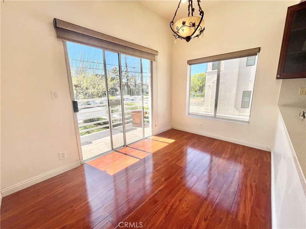 609 Fairview Avenue, Unit 2 Arcadia, CA 91007 - Photo 5 of 22 an empty room with wooden floor and windows