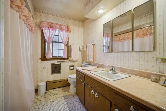 a bathroom with a sink double vanity and a mirror