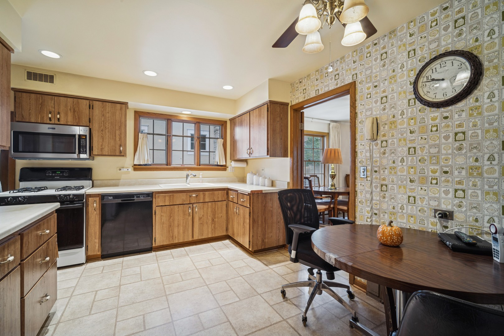 2239 Washington Avenue Wilmette, IL 60091 - Photo 5 of 20 a large kitchen with a table and chairs in it