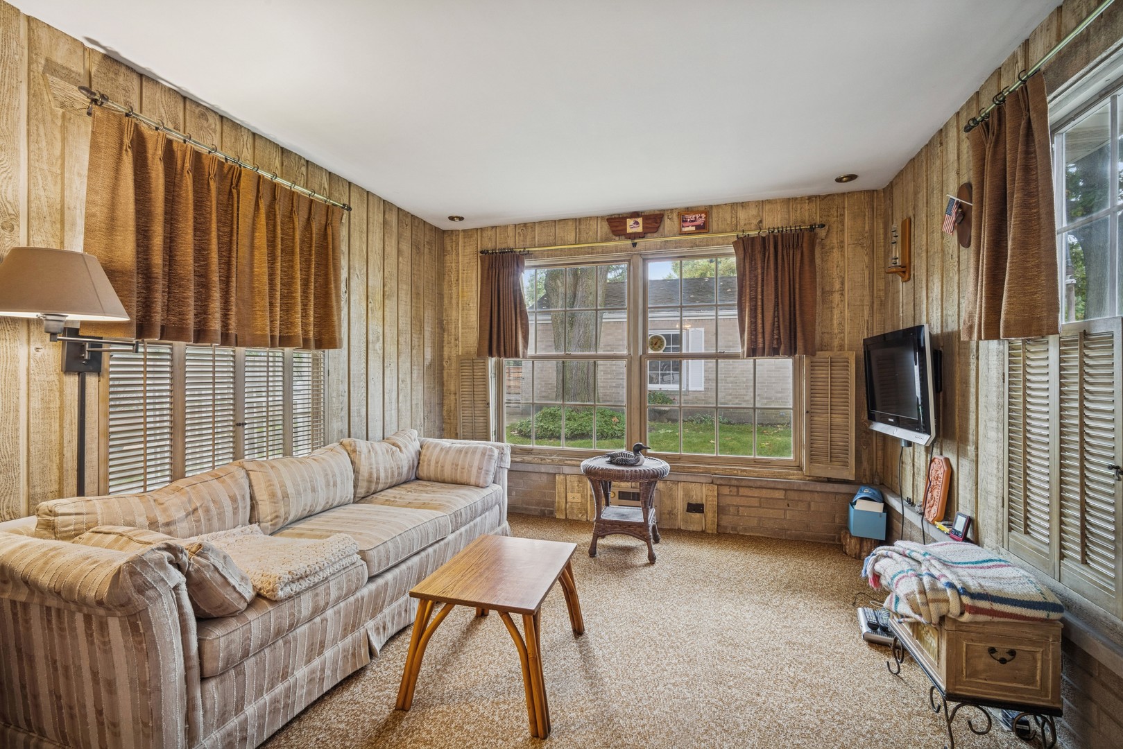 2239 Washington Avenue Wilmette, IL 60091 - Photo 9 of 20 a living room with furniture a flat screen tv and a large window