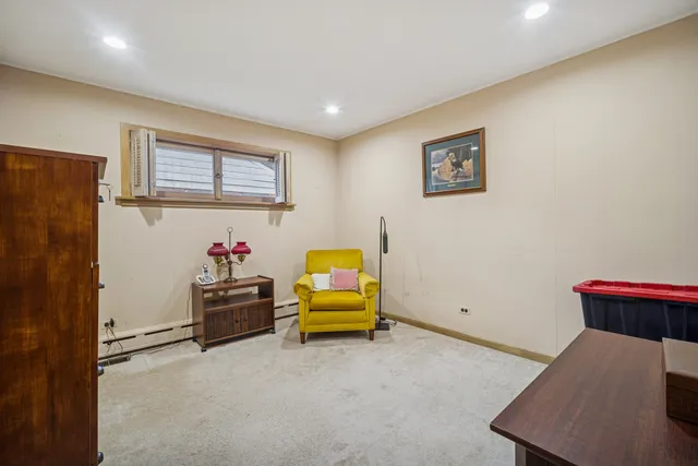 a room with furniture and air conditioner vent