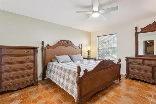 a bed room with a bed and a window