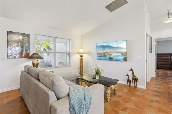 a living room with furniture and a large window