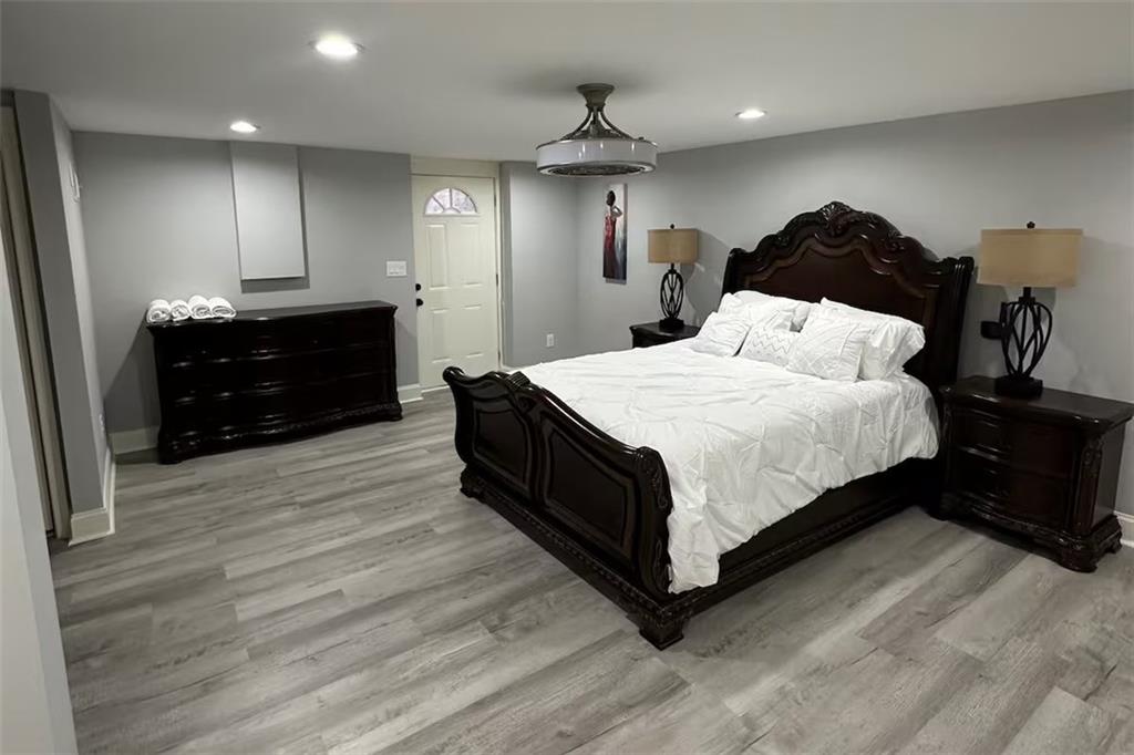 2251 Colonial Oak Way Southwest Stone Mountain, GA 30087 - Photo 13 of 32 a spacious bedroom with a bed and a dresser