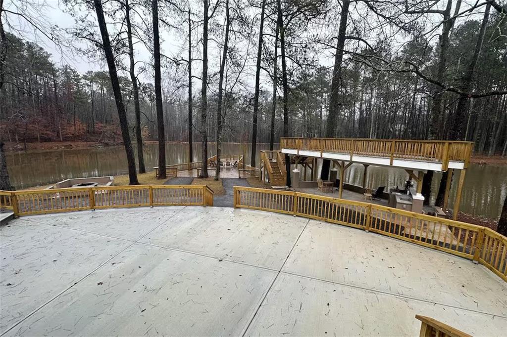 2251 Colonial Oak Way Southwest Stone Mountain, GA 30087 - Photo 16 of 32 a view of swimming pool with sitting area and large trees