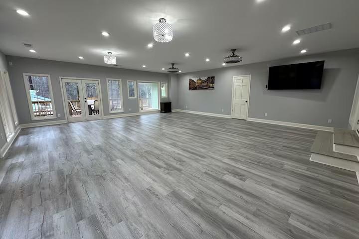 2251 Colonial Oak Way Southwest Stone Mountain, GA 30087 - Photo 19 of 32 a view of an empty room with wooden floor and windows