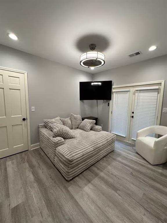 2251 Colonial Oak Way Southwest Stone Mountain, GA 30087 - Photo 20 of 32 a bedroom with a bed and a chandelier