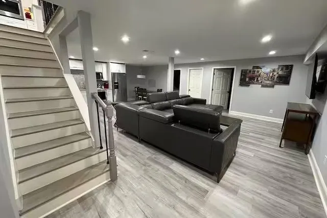 a kitchen with a refrigerator a microwave a stove and a sink