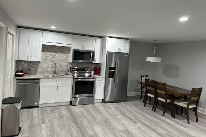 2251 Colonial Oak Way Southwest Stone Mountain, GA 30087 - Photo 24 of 32 a kitchen with a refrigerator a microwave a stove and a sink
