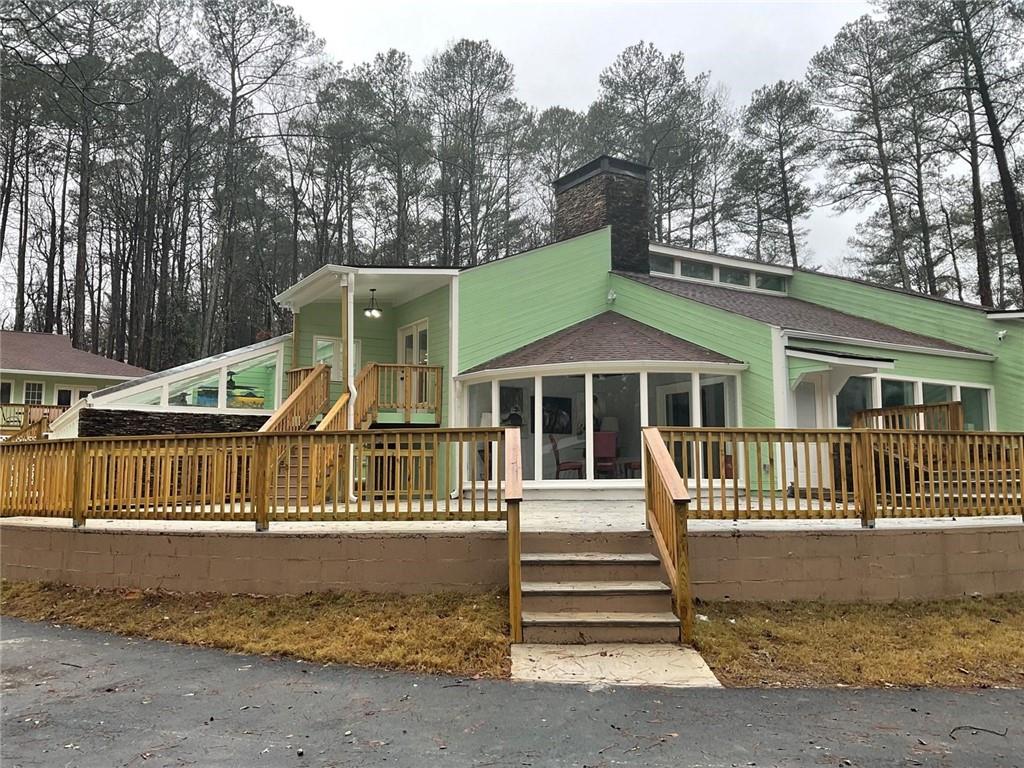 2251 Colonial Oak Way Southwest Stone Mountain, GA 30087 - Photo 26 of 32 a front view of a house with a yard
