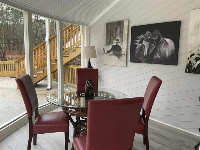 a blue swimming pool with chairs