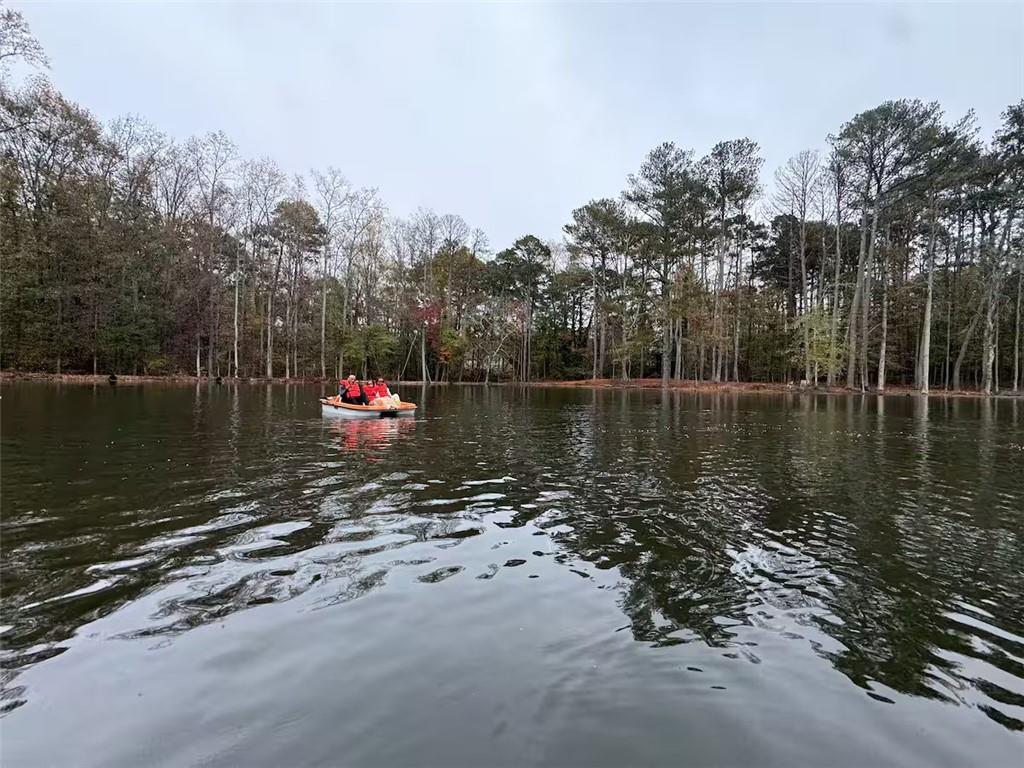 2251 Colonial Oak Way Southwest Stone Mountain, GA 30087 - Photo 30 of 32 a lake view with mountain view