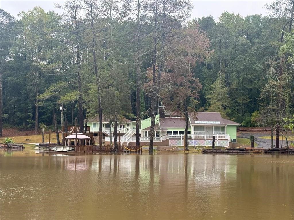 2251 Colonial Oak Way Southwest Stone Mountain, GA 30087 - Photo 32 of 32 a view of a lake with house