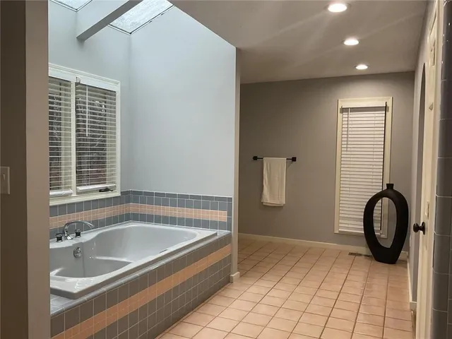 a bathroom with a bathtub and a sink