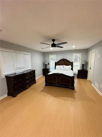 a living room with a bed and furniture