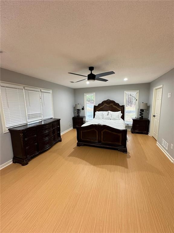 2251 Colonial Oak Way Southwest Stone Mountain, GA 30087 - Photo 8 of 32 a living room with a bed and furniture