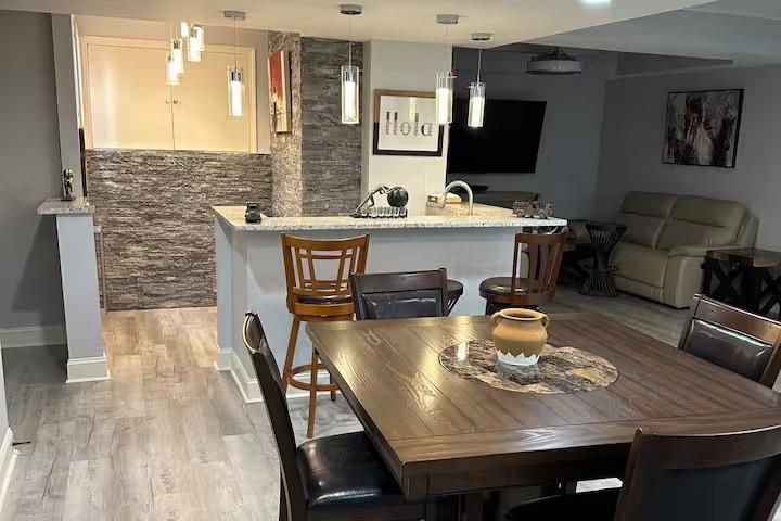 2251 Colonial Oak Way Southwest Stone Mountain, GA 30087 - Photo 10 of 32 a view of a dining room with furniture and wooden floor