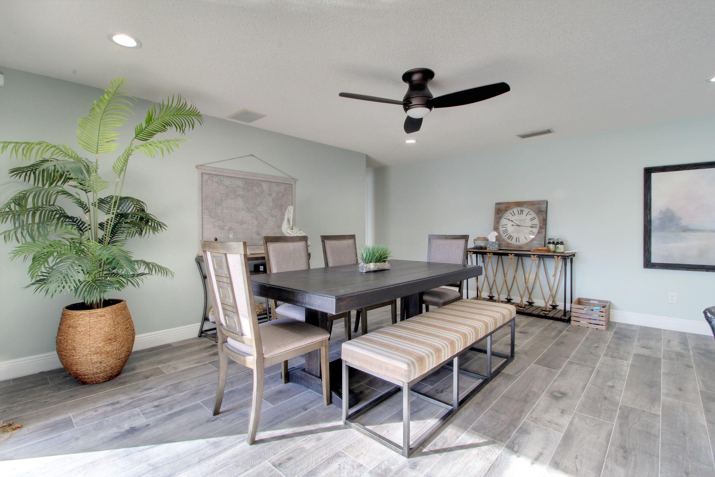 1501 Banyan Road Boca Raton, FL 33432 - Photo 17 of 26 a living room with furniture and a potted plant