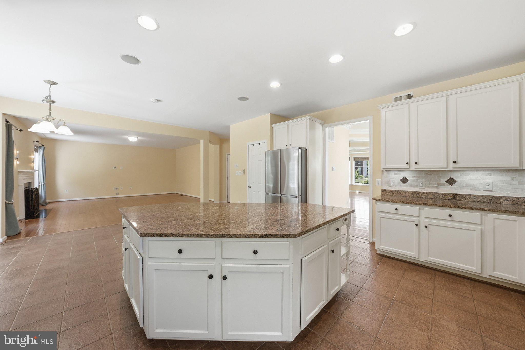 3679 Expedition Drive Triangle, VA 22172 - Photo 17 of 65 a kitchen with stainless steel appliances granite countertop a sink and cabinets