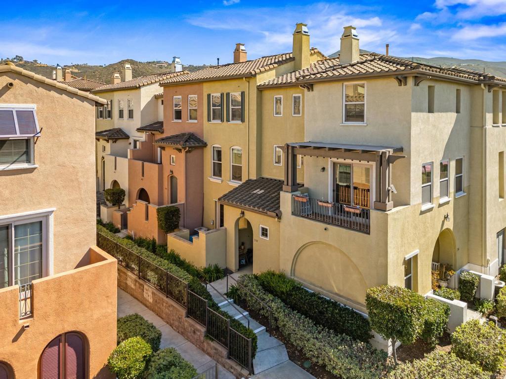 338 Kellogg Street San Marcos, CA 92078 - Photo 2 of 36 a front view of a residential apartment building with a yard