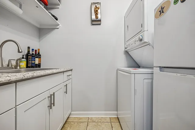 a kitchen with a sink and a refrigerator
