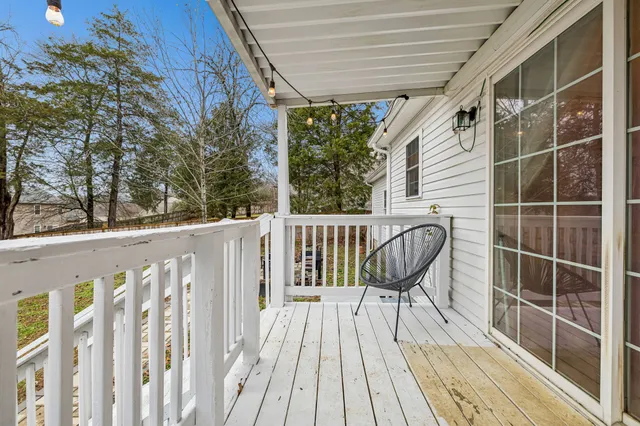a view of a chair and table in the balcony