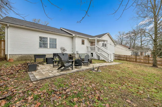a view of a house with chairs in patio