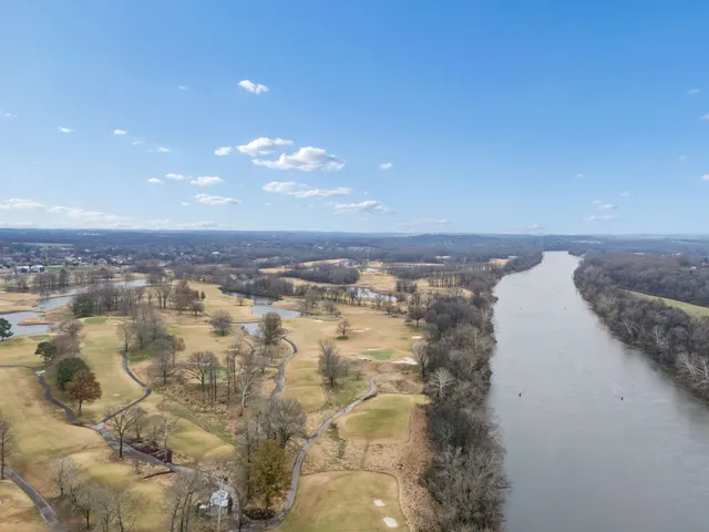 an aerial view of residential house and car parked