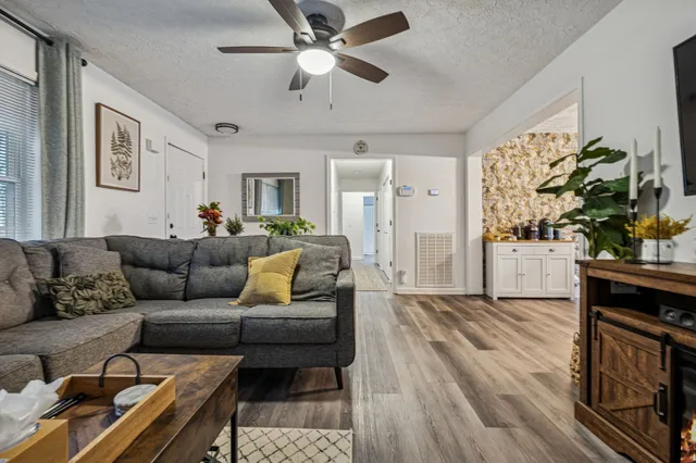 a living room with furniture and a fireplace