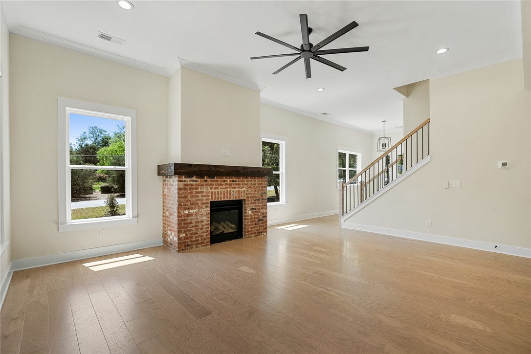 100 Garden Gate Drive Anderson, SC 29621 - Photo 10 of 43 This bright interior features rich hardwood floors, a cozy fireplace, and abundant natural light.